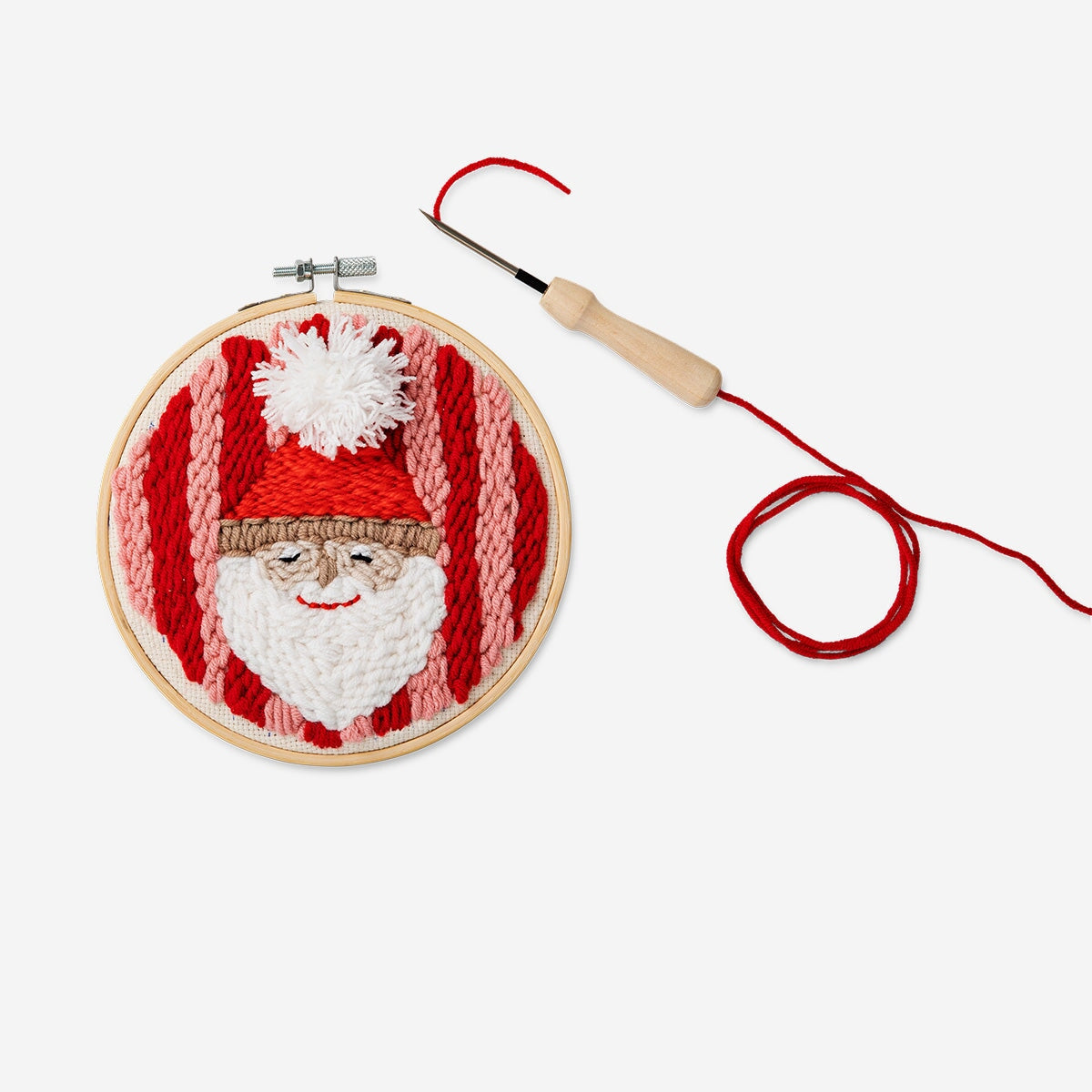 Christmas punch needle set from Flying Tiger Copenhagen, hobby kit with colorful tools and materials for festive embroidery projects.