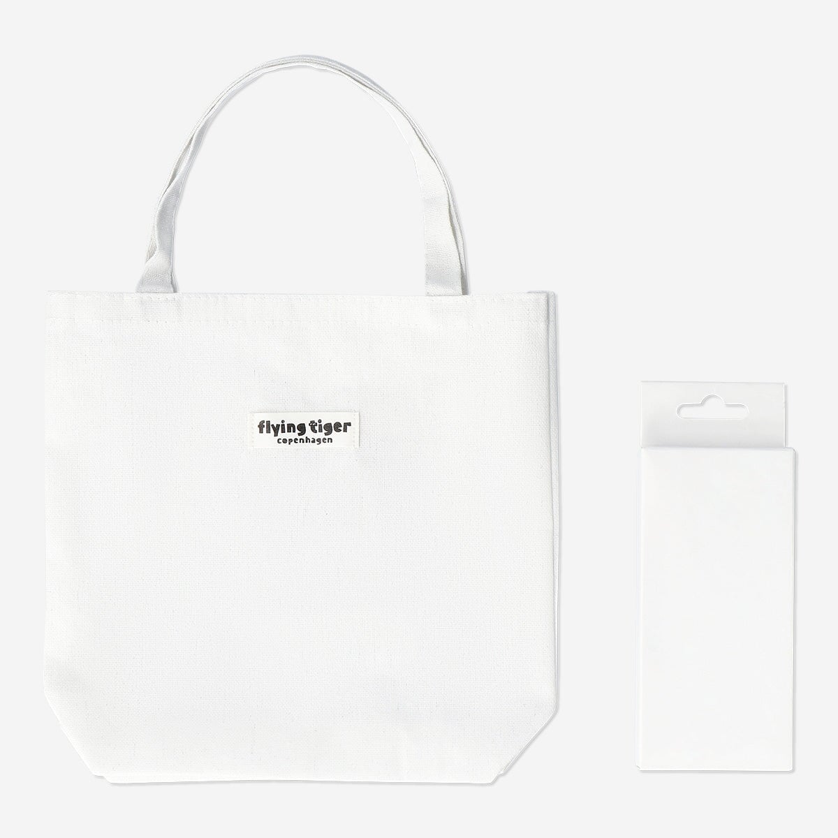 Small tote bag from Flying Tiger Copenhagen for coloring, includes markers for customizing your own vibrant design.