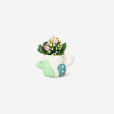 DIY cactus plant pot from Flying Tiger Copenhagen, featuring a colorful hobby-inspired ceramic container with a small cactus inside.