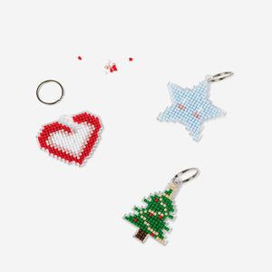 Set of three DIY Christmas key rings from Flying Tiger Copenhagen, colorful holiday-themed craft accessories for decorating keys.