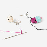 Two DIY crochet keyrings in vibrant colors from Flying Tiger Copenhagen, perfect for craft projects and accessories.
