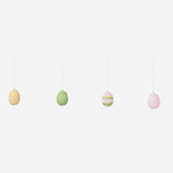 DIY Easter eggs with glass beads for crafting, featuring colorful glass bead decorations on a white background.