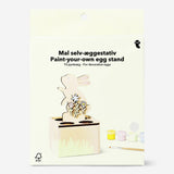 DIY egg stand hobby kit by Flying Tiger Copenhagen includes a stand, paint, and brush for creative decorating projects.