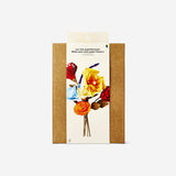 Colorful DIY paper flowers from Flying Tiger Copenhagen, perfect for hobby craft projects and home decoration.