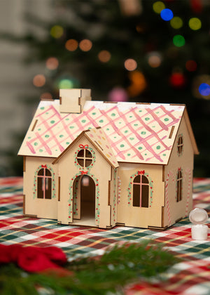 Wooden gingerbread house craft kit by Flying Tiger Copenhagen, 23 cm tall, includes paint for DIY holiday decoration.