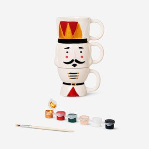 Set of three DIY stackable nutcracker mugs with paint from Flying Tiger Copenhagen for creative hobby crafting.