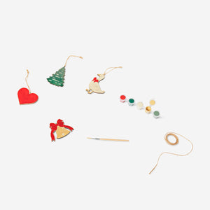 Set of five DIY wooden Christmas ornaments from Flying Tiger Copenhagen, featuring natural wood finish and festive holiday designs.