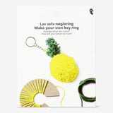 DIY lemon-shaped key ring craft kit by Flying Tiger Copenhagen, featuring colorful materials for making your own playful keychain.