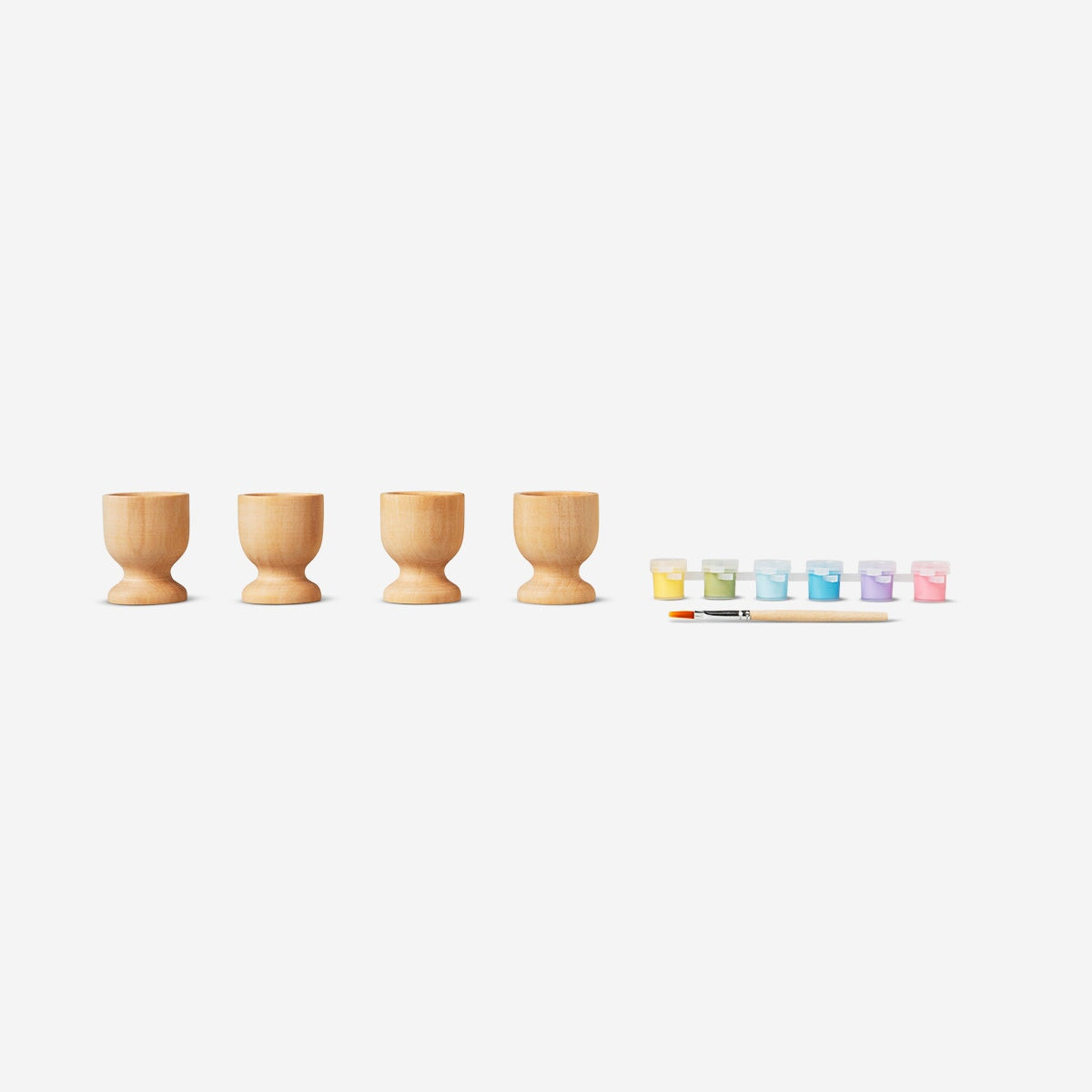 Paint-your-own egg cups hobby kit from Flying Tiger Copenhagen, featuring blank ceramic egg cups for decorating and painting.