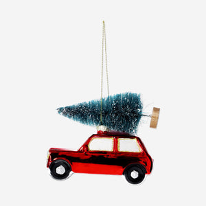 Flying Tiger Copenhagen Christmas bauble featuring a car carrying a decorated Christmas tree, ideal for holiday home décor.