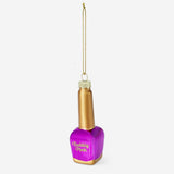 Christmas-themed nail polish in a decorative Flying Tiger Copenhagen bauble, perfect for holiday manicures.