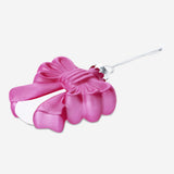 Pink Christmas bauble with a decorative bow from Flying Tiger Copenhagen, perfect for holiday home decor.
