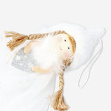Decorative angel figurine with blonde hair for home decor, by Flying Tiger Copenhagen, showcasing intricate details and a serene expression.