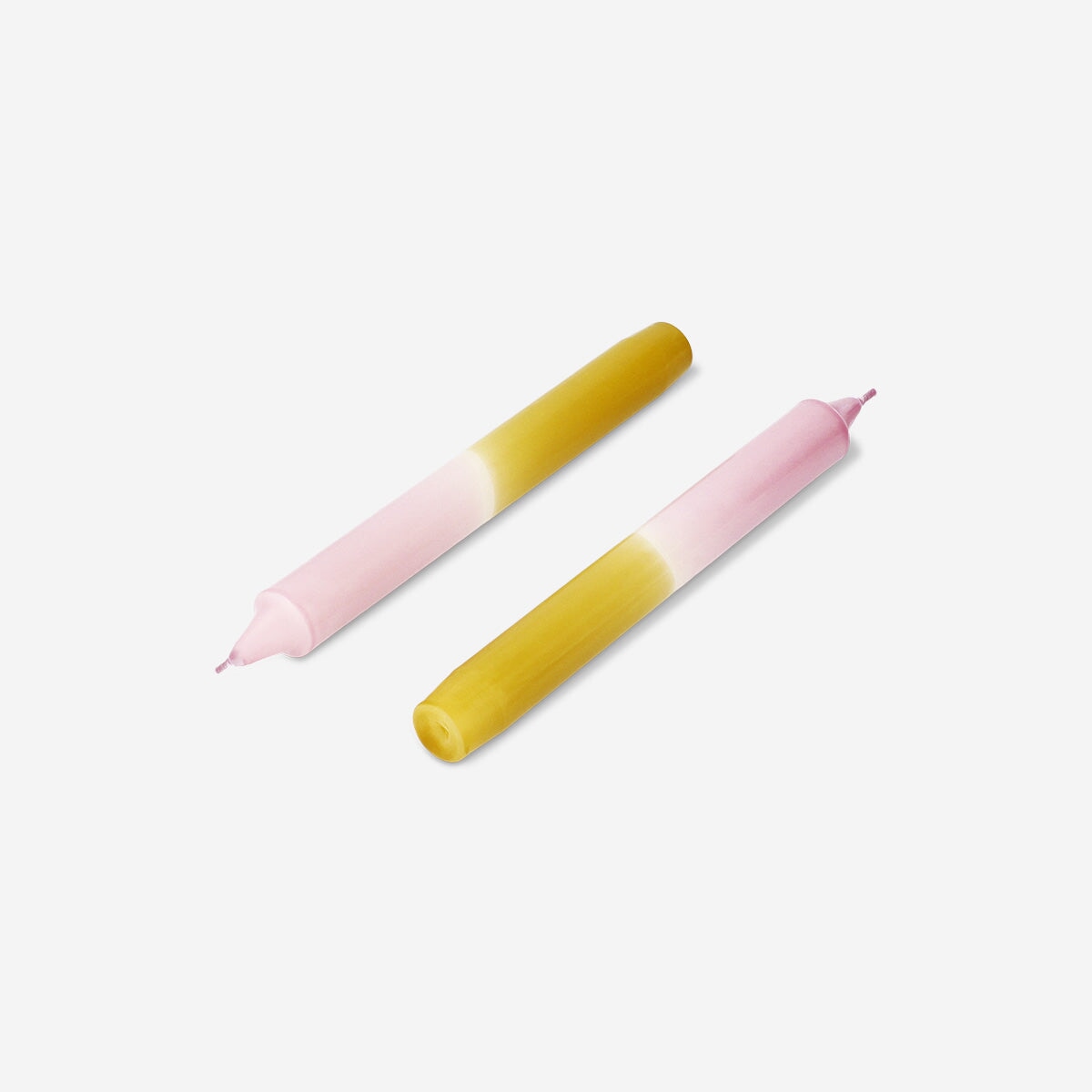 Set of three 20 cm dip dye dinner candles by Flying Tiger Copenhagen for home decor, featuring vibrant color gradients.