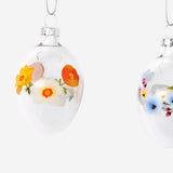 Set of four Easter glass ornaments featuring colorful designs, perfect for home holiday decorations by Flying Tiger Copenhagen.
