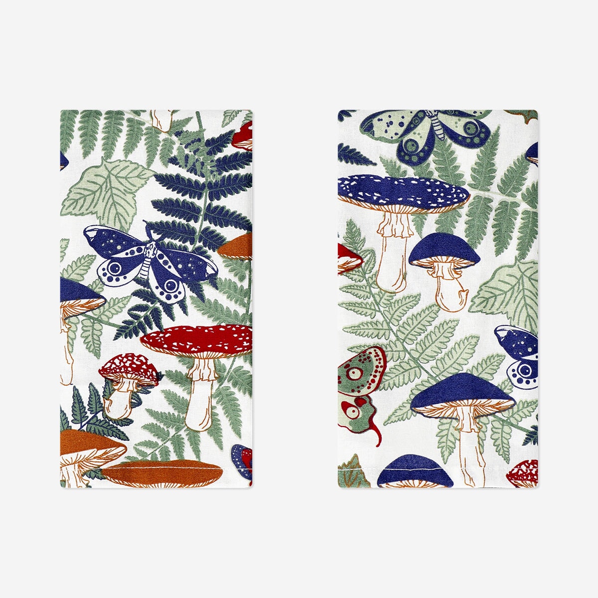 Two forest print fabric napkins from Flying Tiger Copenhagen, showcasing a nature-inspired design and soft textile material.