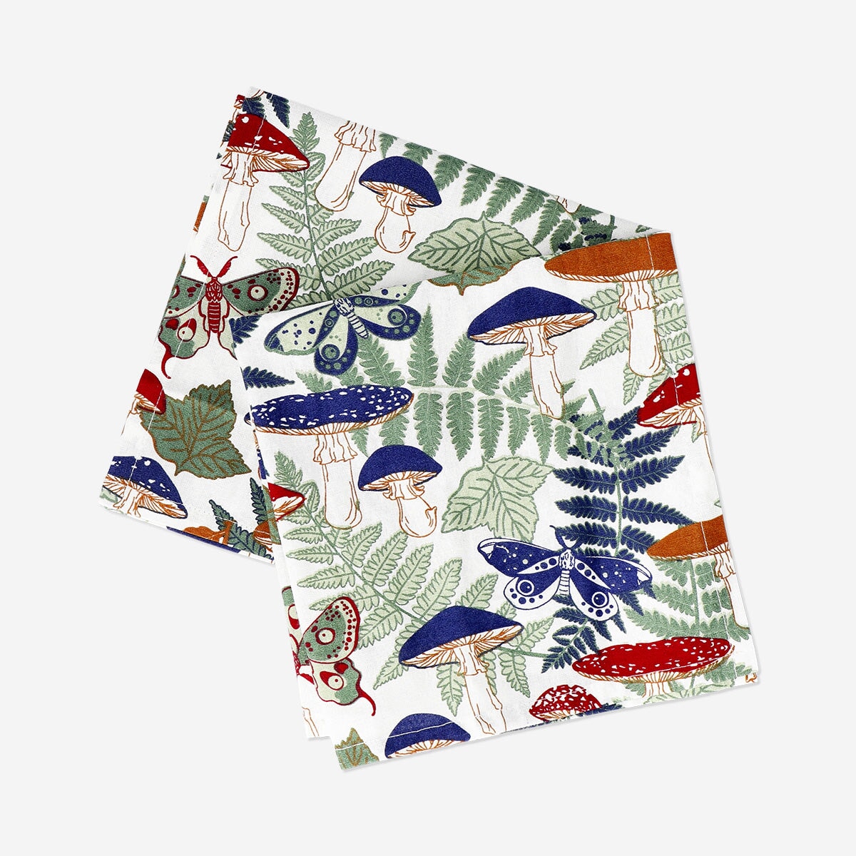 Two forest print fabric napkins from Flying Tiger Copenhagen for home decor, featuring detailed woodland tree designs.