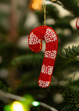 Hanging ornament featuring a candy cane with colorful beads, decorative home décor from Flying Tiger Copenhagen.
