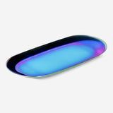 Holographic dish from Flying Tiger Copenhagen for home decor, featuring a shiny, iridescent surface with a sleek, modern design.
