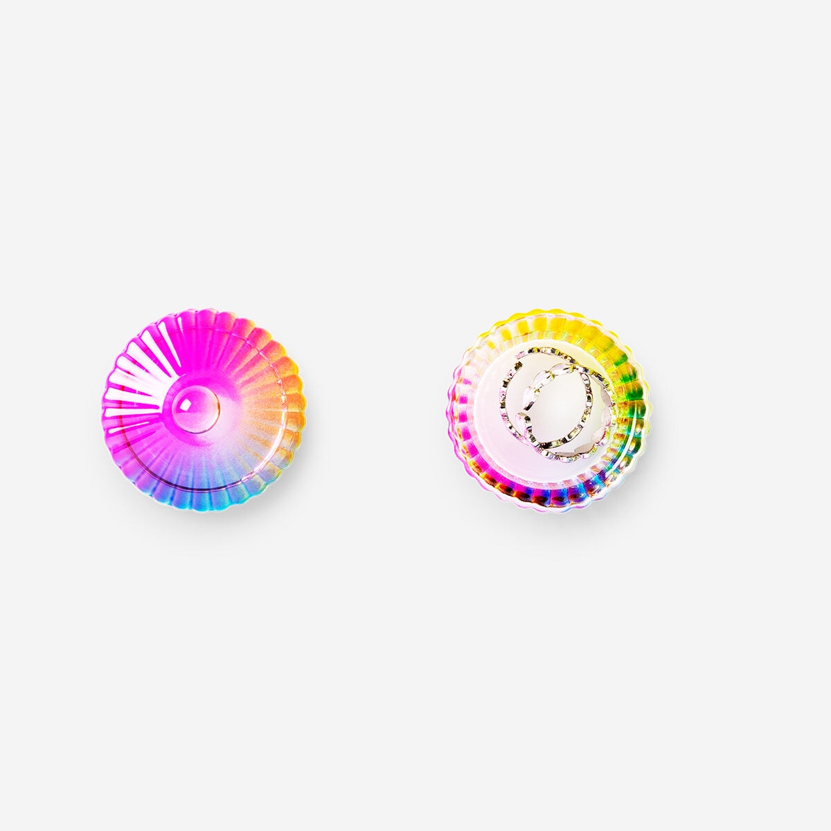 Mini decorative rainbow jar from Flying Tiger Copenhagen, round glass container with colorful rainbow design for home decor.