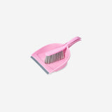 Pink dust brush and dustpan set from Flying Tiger Copenhagen for home cleaning, with a compact design and soft bristles.
