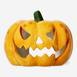 Pumpkin-shaped candle holder from Flying Tiger Copenhagen, decorative home accessory with a warm, autumn-inspired design.