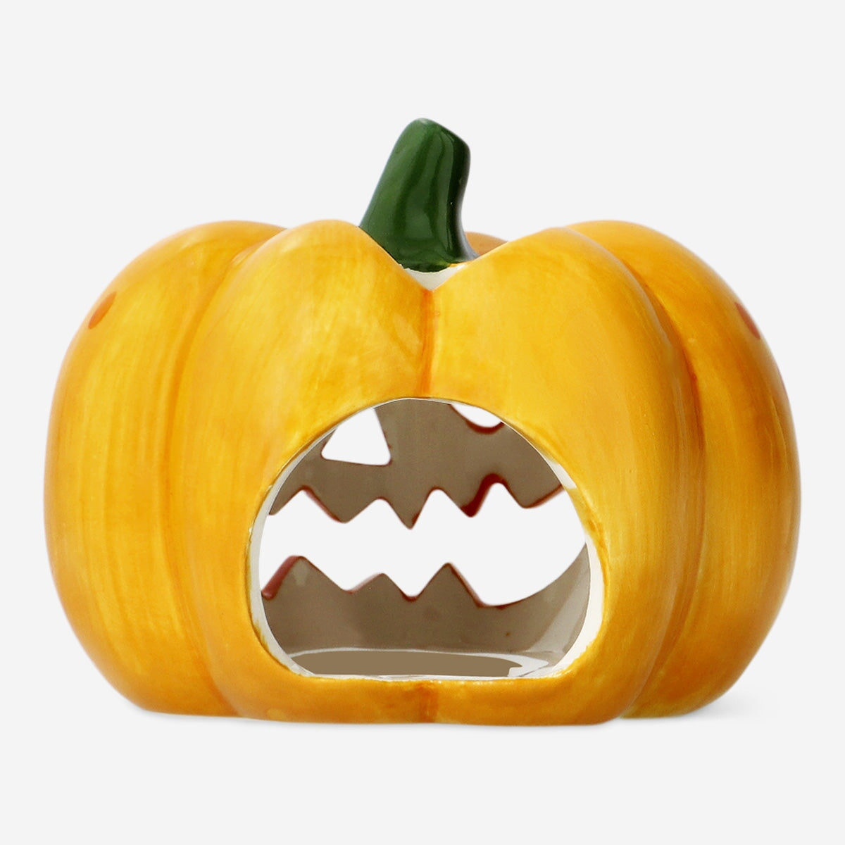 Pumpkin-shaped candle holder from Flying Tiger Copenhagen, decorative home accessory with a warm, festive design.