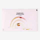 Rainbow jewellery stand for earrings with colorful arches, made by Flying Tiger Copenhagen, perfect for organizing accessories.