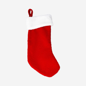 Red Christmas stocking from Flying Tiger Copenhagen, festive home decor with a cozy, traditional design for holiday celebrations.
