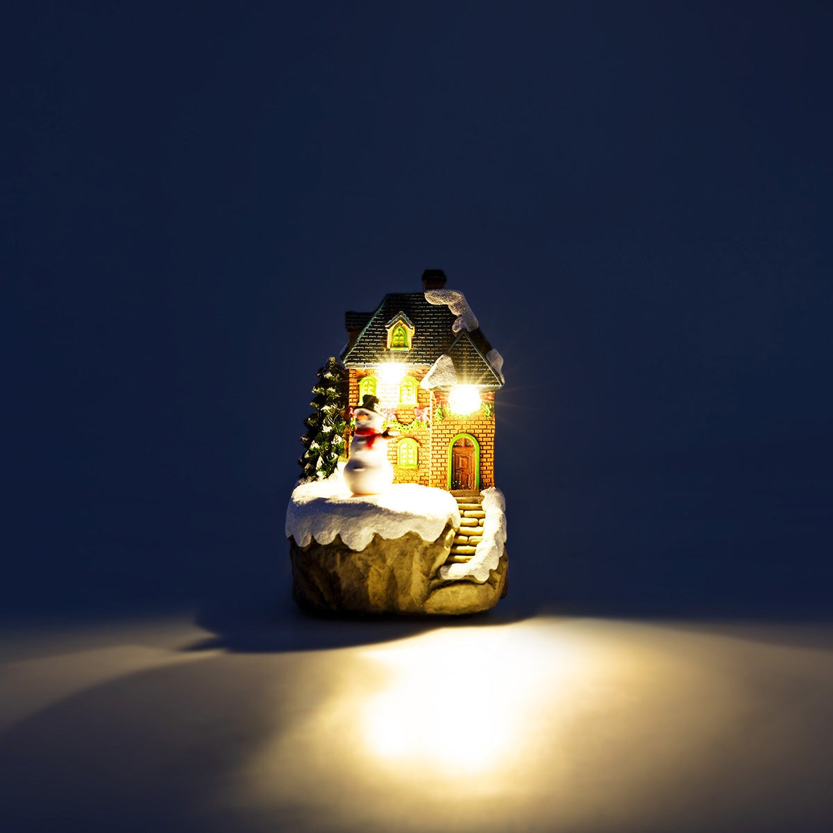 Flying Tiger Copenhagen Christmas village scene with musical movement and festive decorations for home holiday display.