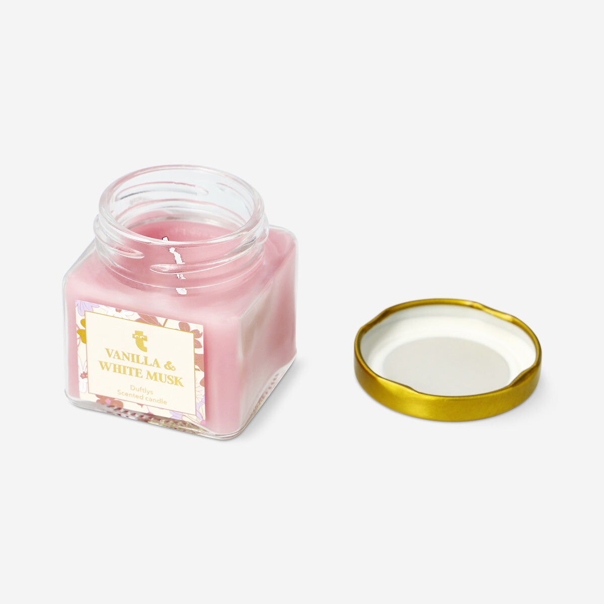Flying Tiger Copenhagen scented candle with white musk and warm vanilla fragrance, featuring a simple white container.