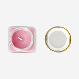 Flying Tiger Copenhagen scented candle with white musk and warm vanilla fragrance, in a glass holder for home decor.