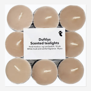 Set of 18 scented tealights from Flying Tiger Copenhagen with white musk and vanilla fragrance in small glass holders.