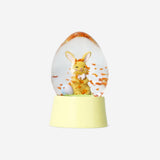 Flying Tiger Copenhagen snow globe featuring an Easter bunny with festive decorations inside.
