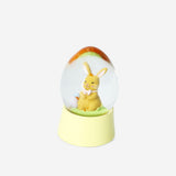 Flying Tiger Copenhagen snow globe featuring Easter bunny with spring flowers inside, decorative home decor item.