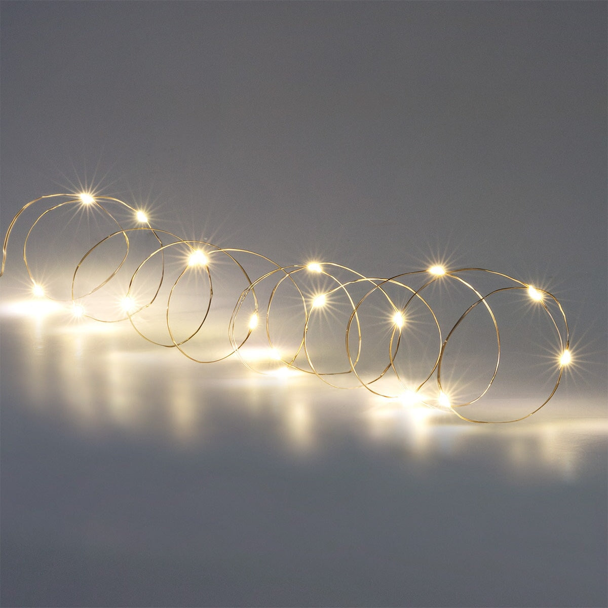 Flying Tiger Copenhagen 330 cm string lights for home décor, featuring clear bulbs on a flexible wire for cozy lighting.
