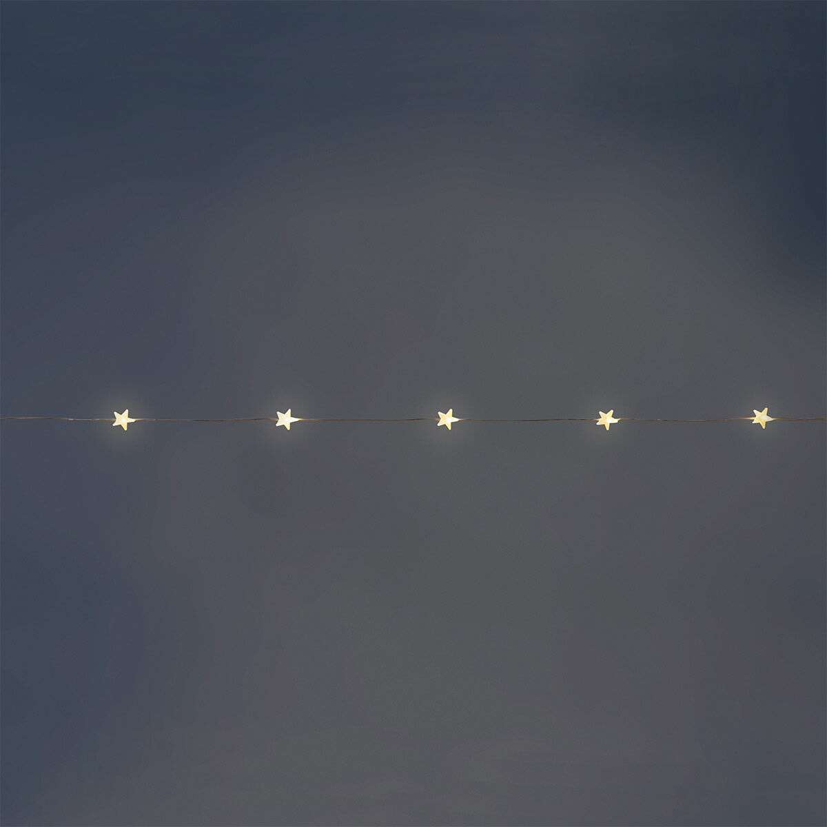 Flying Tiger Copenhagen star string lights, 220 cm long, with warm glowing star-shaped bulbs for cozy home decoration.