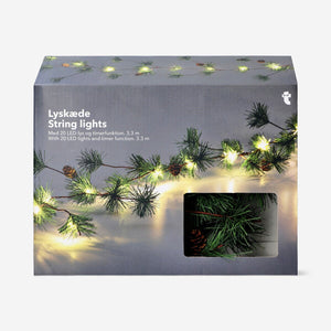 Flying Tiger Copenhagen string lights with timer and pine cones, 330 cm long, decorative home lighting for cozy ambiance.