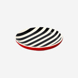 Black and white striped ceramic trinket tray from Flying Tiger Copenhagen for home decor or jewelry organization.