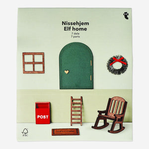 Seven-piece wooden elf home set by Flying Tiger Copenhagen featuring handcrafted elf figures and cozy wooden house accessories.