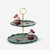 Cake stand with embossed holly pattern from Flying Tiger Copenhagen, featuring a decorative kitchen display piece