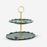 Cake stand with embossed holly pattern, Flying Tiger Copenhagen kitchenware, showcasing a decorative and functional dessert display.