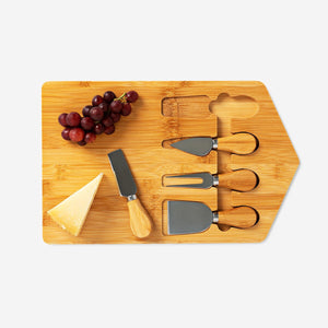 Flying Tiger Copenhagen 5-piece cheese set with cheese knives and accessories for kitchen use, displayed on a wooden board.