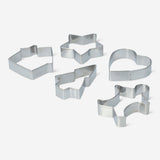 Set of five Flying Tiger Copenhagen kitchen cookie cutters in various fun shapes for baking and decorating cookies.