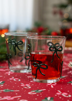 Clear drinking glass with embossed bows, 220 ml, from Flying Tiger Copenhagen, suitable for kitchen and beverage use.