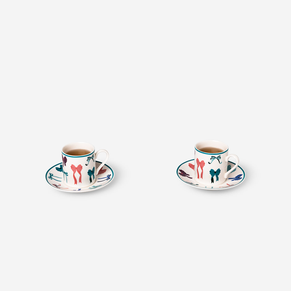 Espresso mugs with saucers and bow print - 4 pcs