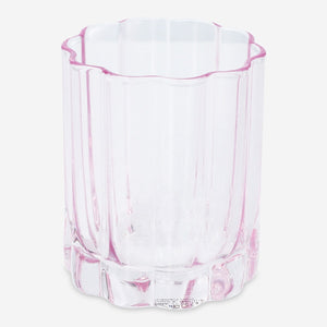 Flower-shaped drinking glass from Flying Tiger Copenhagen, clear kitchen glassware with floral design for stylish beverage serving.