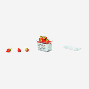 Green 14 cm food storage container from Flying Tiger Copenhagen, ideal for organizing fridge contents.