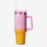 Multi-colored Flying Tiger Copenhagen kitchen tumbler with lid and straw for beverages.