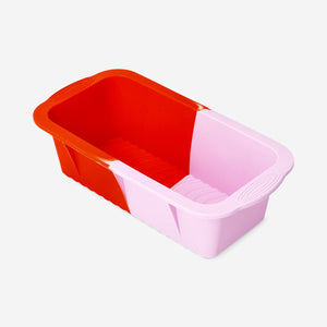 Pink and red silicone baking mold from Flying Tiger Copenhagen, flexible kitchen accessory for baking desserts and treats.